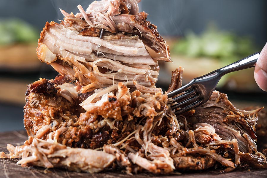 This slow cooker pulled pork is a perennial favorite in our family! It's moist, scrumptious, and easy to prepare. We love it for quick weeknight dinners and parties too!